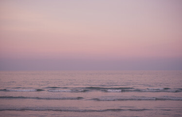 Beautiful relaxing sunset beach. Beautiful cloudscape over the sea at sunset. Ocean beach sunset with deep blue sky.