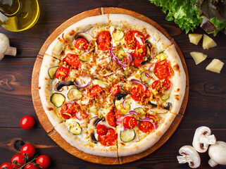 Pizza with mushrooms, champignons, vegetables, mozzarella cheese and fried onions. Freshly baked vegetarian dish. Menu of cafes, pizzeria, restaurant. Close up. Copy space. Fresh champignons, cherry
