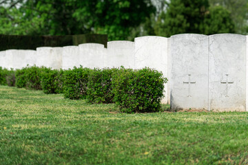 Fototapeta na wymiar Rows of white tombstones at the military memorial cemetery.