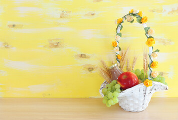 Photo of dairy products over wooden table. Symbols of jewish holiday - Shavuot