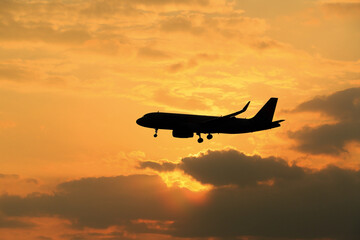 Fototapeta na wymiar airplane at sunset