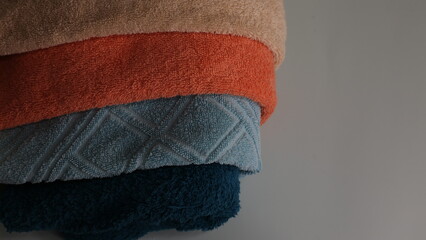 Multicolored cotton towels. Background for text, textural abstraction. Sketches of woven products. Soft, light background