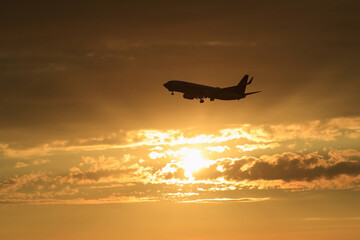 silhouette of a plane on sunset