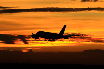 Naklejka na ściany i meble airplane in sunset