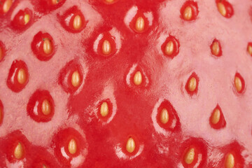 Background of strawberry surface. Red strawberry close-up macro