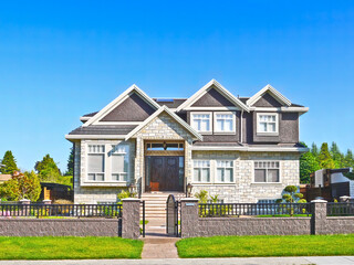 Nice and neat residential house with concrete pathway in the front