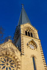 Obraz premium tower of a catholic church with a clock