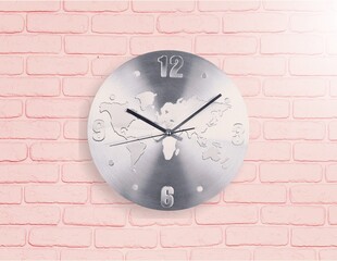 Wall clock set on pastel background. Wall clock over pink background.