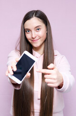 Atractive woman pointing at smartphone Mock up