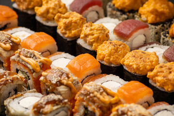 Solid background of japanese sushi rolls with fresh fish