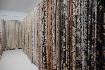 Collection of curtains in different colors and patterns. Salon curtains