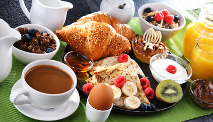 Breakfast served with coffee, juice, pancakes and croissants