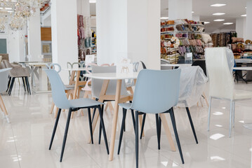 Chairs in the furniture salon. Showroom, showroom of modern upholstered furniture and chairs