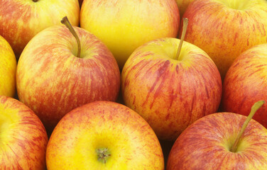 Ripe tasty yellow-red apples background