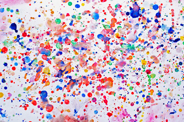 Drops of watercolors on a white sheet. Splatter from watercolor. Paints.