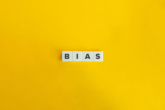 Bias Word on Letter Tiles on Yellow Background. Minimal Aesthetics.