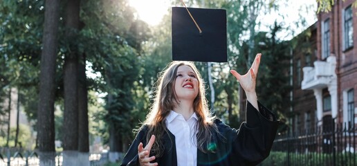 Cute teenage graduate girl laughing and having fun. No school, back to school concept. Graduation. Education. Banner.