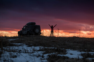 Black American SUV on the background of a beautiful sunset © Павел Ващенков