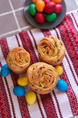 Easter cake and eggs on traditional ukrainian embroidered towel