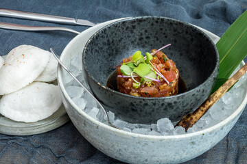 Tuna tar tar with avocado on ice side view