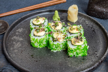 California green roll with crab on grey plate side view