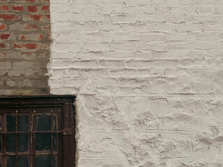 Old brick wall with window