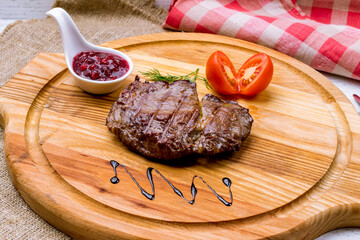 roast beef Steak with berry sauce on the board