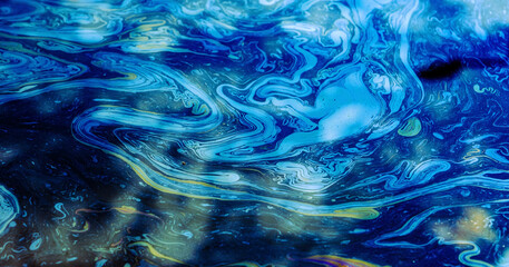 Rainbow colors created by diesel fuel floating on the water - obrazy, fototapety, plakaty