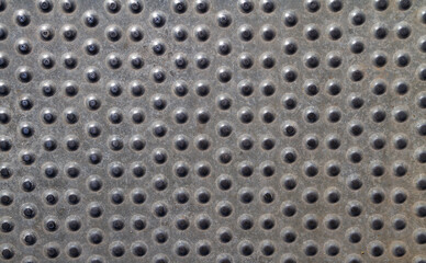 Anti slip embossed metal steel plate texture. Perforated antiskid flooring, anti-slip tread panel.