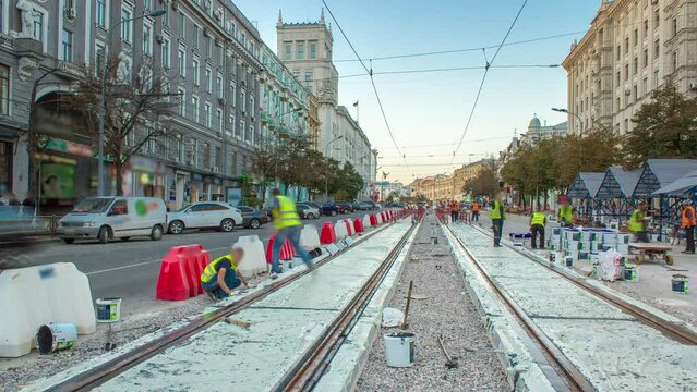 Tram rails at the stage of their installation and integration into concrete plates on the road timelapse.
