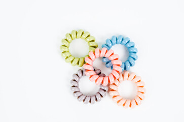 Group of colorful spiral rubber bands. Elastic hair ties in vibrant colors.
