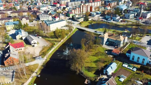 Aerial Shot of Birzai Castle, Fortress Birzai - a Castle in Birzai, on the Southern Coast of the Lake &Scaron;irvėna in Lithuania, Sunny Spring Day. Historic Beautiful Church and Birzai City Panorama 4K UHD 