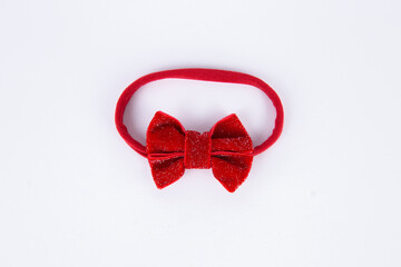 red bow hairpin decoration for a girl on a white background
