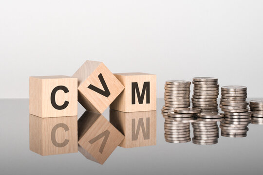 CVM - the text is made up of letters on wooden cubes lying on a mirror surface