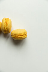 Yellow macaroons  on white background