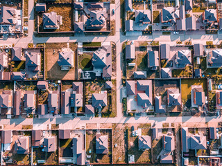 Aerial view of a luxurious village with smooth rows of two-storey duplex houses. Neighborhood in...