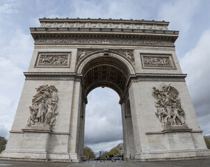 Fototapeta na wymiar Paris, France, Europe: the Triumphal Arch of the Star (Arc de Triomphe de l'Etoile), one of the most famous monuments of Paris, at the western end of the Champs Elysees in Place Charles de Gaulle 