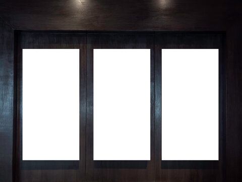 Three mockup vertical rectangle painting frames hanging on dark wood wall background with copy space. Blank white canvas frame with empty space in gallery.