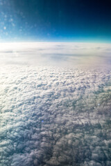 Blue sky and clouds. View from the plane.