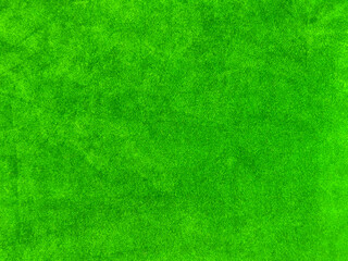 green velvet fabric texture used as background. Empty green fabric background of soft and smooth textile material. There is space for text..
