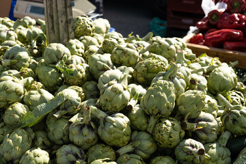 Artichoke in boxes at the bazaar close-up.