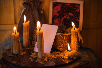 Magical illustration, esoteric concept. Candles for clean your energy, reiki. Gem stones and other stuff on a table