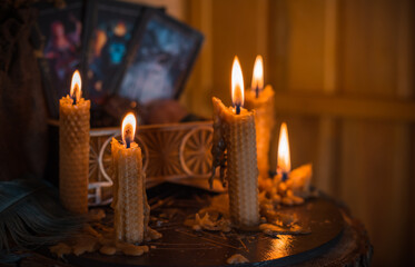 Magical illustration, esoteric concept. Candles for clean your energy, reiki. Gem stones and other stuff on a table