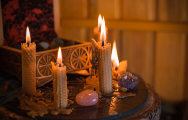 Magical illustration, esoteric concept. Candles for clean your energy, reiki. Gem stones and other...
