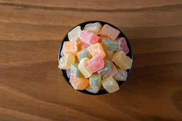 Traditional Turkish delight in a bowl on a wooden background	