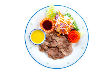 Top view Grilled steaks and vegetables.Beef steak on white plate with vegetables and sauce isolated on white background.