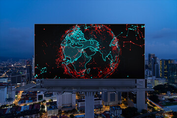 Hologram of Earth planet map on billboard over night panoramic cityscape of Kuala Lumpur, Malaysia,...
