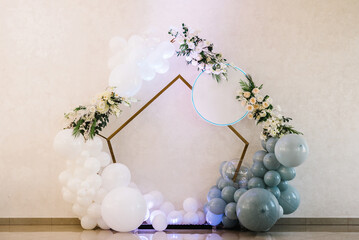 Wedding arch. Birthday decorations - balloons, garland and decor for party on a wall background....