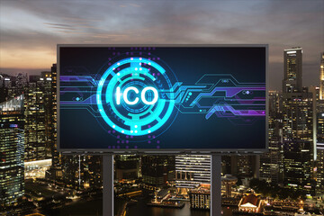 ICO hologram icon on billboard over panorama city view of Singapore at night time. The hub of...