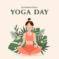 International Yoga Day. Woman doing yoga in lotus position, against the background of tropical leaves and flowers.
